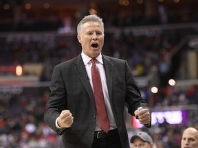 FILE - In this Sunday, Feb. 25, 2018 file photo, Philadelphia 76ers head coach Brett Brown reacts towards the bench during the second half of an NBA basketball game against the Washington Wizards in Washington. Philadelphia 76ers coach Brett Brown said the organization will hire a general manger to replace Bryan Colangelo before the start of the season.