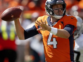FILE - In this Sept. 16, 2018, file photo, Denver Broncos quarterback Case Keenum (4) looks to pass against the Oakland Raiders during the first half of an NFL football game, in Denver. The Broncos travel top Baltimore for a game against the Ravens on Sunday.