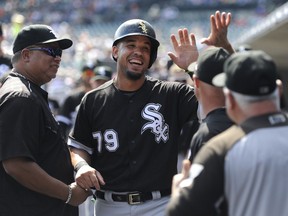 FILE - In this Thursday, Sept. 14, 2017 file photo, Chicago White Sox first baseman Jose Abreu (79) is congratulated in the dugout after scoring a run against the Detroit Tigers in the first inning of a baseball game in Detroit. White Sox slugger Jose Abreu will miss Chicago's three-game series against the Cleveland Indians because of an infection in his right thigh. Manager Rick Renteria says Abreu had the infection "cleaned up" at a hospital in Cleveland. He says the team will provide an update on Abreu on Friday, Sept. 21, 2018