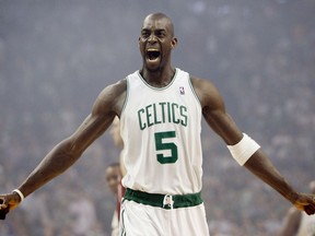 FILE - In this May 6, 2008, file photo, Boston Celtics' Kevin Garnett gestures to the crowd just before tipoff in Game 1 of an NBA Eastern Conference semifinal basketball series against the Cleveland Cavaliers in Boston. Kevin Garnett is suing an accountant and his firm, alleging they helped a wealth manager steal $77 million from the retired NBA star.