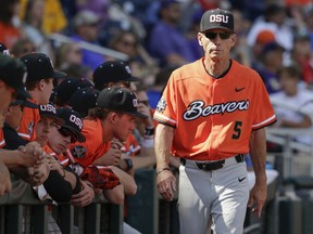 FILE - In this Saturday, June 24, 2017 file photo, Oregon State coach Pat Casey walks in front of the dugout in the ninth inning of an NCAA College World Series baseball elimination game against LSU in Omaha, Neb. Oregon State coach Pat Casey has announced his retirement after 24 seasons and three national championships with the team.