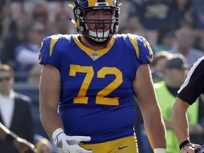 FILE - In this Dec. 31, 2017, file photo, Los Angeles Rams' Aaron Neary looks on during the first half of an NFL football game against the San Francisco 49ers in Los Angeles. Neary, a center on the Rams' practice squad, has been arrested on suspicion of driving under the influence and damaging property. The Simi Valley Police Department says it received several calls about an erratic driver who had hit a bus stop sign and mailboxes and trash cans on Sunday, Sept. 16, 2018, about two hours after the Rams' victory over the Arizona Cardinals.