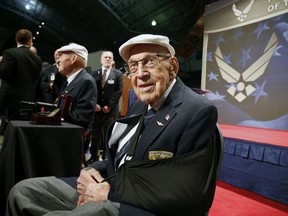 FILE - In this April 18, 2015, file photo, two members of the Doolittle Tokyo Raiders, retired U.S. Air Force Lt. Col. Richard "Dick" Cole, seated front, and retired Staff Sgt. David Thatcher, seated left, pose for photos after the presentation of a Congressional Gold Medal honoring the Doolittle Tokyo Raiders at the National Museum of the U.S. Air Force at Wright-Patterson Air Force Base in Dayton, Ohio. The last surviving Doolittle Tokyo Raider is still telling his World War II stories, and he enjoys hearing new ones passed down to younger generations.