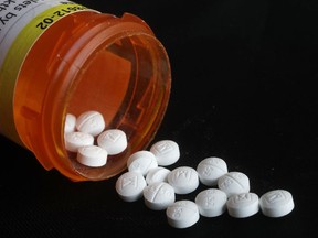 This Aug. 29, 2018 photo shows an arrangement of prescription Oxycodone pills in New York. Figures from a 2017 survey released on Friday, Sept. 14, 2018, show fewer people used heroin for the first time compared to the previous year, and fewer Americans misusing or addicted to prescription opioid painkillers.