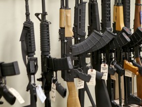 FILE - This March 1, 2018 file photo shows a display of various models of semi-automatic rifles at a store in Pennsylvania. Research published Tuesday, Sept. 11, 2018 in the Journal of the American Medical Association shows active shooters with semi-automatic rifles wound and kill twice as many people as those using non-automatic weapons.