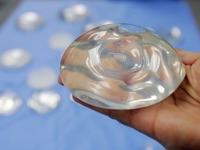 FILE - This Dec. 11, 2006 file photo shows a silicone gel breast implant at a manufacturing facility in Irving, Texas. On Friday, Sept. 14, 2018, U.S. health officials said they will convene a public meeting of medical advisers in 2019 on the safety of breast implants because of growing science on the topic, including an independent analysis that suggests certain rare health problems might be more common in women with implants containing silicone gel.