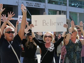 FILE - In this Thursday, Sept. 27, 2018 file photo, protesters against Brett Kavanaugh shout during a rally at the Wallace F. Bennett Federal Building in Salt Lake City. Some skeptics of #MeToo activism are hoping Brett Kavanaugh's angry, tearful denial of sexual assault allegations might help fuel a backlash against the year-old movement. But advocates for victimized women say it's now too powerful to be derailed.