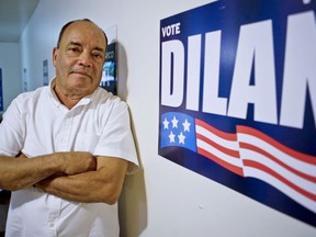 In this Aug. 30, 2018, photo, New York State Sen. Martin Dilan, a Democrat for Brooklyn's 18th senate district, pose in his campaign headquarters in New York. Julia Salazar is taking on the 16-year-incumbent Dilan.