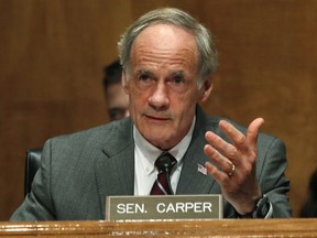 FILE - In this May 15, 2018, file photo, Sen. Thomas Carper, D-Del., asks a question of Homeland Security Secretary Kirstjen Nielsen as she testifies to the Senate Homeland Security Committee on Capitol Hill in Washington. Kerri Evelyn Harris, whose resume includes loading giant Air Force cargo planes, frying chicken at a convenience store chain and working as an auto body mechanic, is seeking in the Thursday, Sept. 6, Democratic primary to unseat three-term incumbent Carper, one of the most successful politicians in Delaware history.