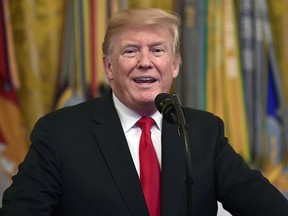 In this Sept. 12, 2018, file photo, President Donald Trump speaks during a Congressional Medal of Honor Society Reception in the East Room of the White House in Washington.