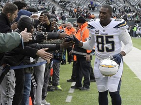 FILE - In this Dec. 24, 2017, file photo, Los Angeles Chargers tight end Antonio Gates (85) greets fans before an NFL football game against the New York Jets in East Rutherford, N.J. Gates has re-signed with the Los Angeles Chargers for his 16th season. The Chargers announced a one-year deal Sunday, Sept. 2, 2018, with Gates, the leading receiver in franchise history.