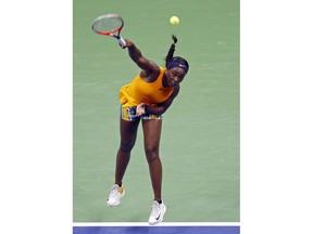 Sloane Stephens, of the United States, serves to Elise Mertens, of Belgium, during the fourth round of the U.S. Open tennis tournament Sunday, Sept. 2, 2018, in New York.