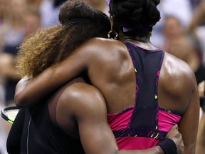 Serena Williams, left, embraces her sister Venus Williams after their third-round match at the U.S. Open tennis tournament Friday, Aug. 31, 2018, in New York. Serena Williams won 6-1, 6-2.