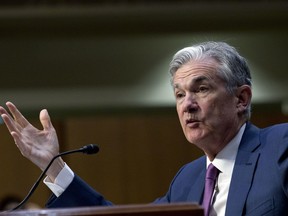 FILE- In this July 17, 2018, file photo Federal Reserve Board Chair Jerome Powell testifies before the Senate Committee on Banking, Housing, and Urban Affairs on "The Semiannual Monetary Policy Report to the Congress," at Capitol Hill in Washington. The Federal Reserve will surprise no one if it does Wednesday, Sept. 26, what it's poised to do for a third time this year: Raise its key short-term interest rate by a modest quarter-point to help keep inflation in check, and signal that another hike is likely in December.