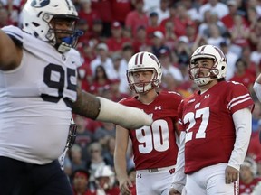FILE - In this Saturday, Sept. 15, 2018, file photo, Wisconsin kicker Rafael Gaglianone (27) reacts after he missed a field goal in the final seconds of the second half of an NCAA college football game against BYU in Madison, Wis. Traditional Big Ten powers Wisconsin, Michigan and Michigan State have lost out-of-conference games. Slow starts, however, doesn't mean the conference is out of the national title hunt.
