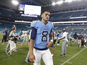 FILE - In this Sept. 9, 2018, file photo, Tennessee Titans quarterback Marcus Mariota (8) walks off the field at the end of a 27-20 loss to the Miami Dolphins, in Miami Gardens, Fla. Mariota injured his right elbow in the season opener. If he doesn't improve, backup Blaine Gabbert would make his second straight start on Sunday against his old team the Jacksonville Jaguars.