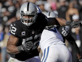 FILE - In this Dec. 24, 2016, file photo, Oakland Raiders defensive end Khalil Mack (52) rushes against the Indianapolis Colts during an NFL football game in Oakland, Calif. The Chicago Bears have acquired star pass rusher Khalil Mack from the Raiders on Saturday, Sept. 1, 2018, in a massive trade that sends two first-round draft picks to Oakland. A person with direct knowledge of the trade told The Associated Press that Oakland will get first-round selections in 2019 and 2020, a sixth-rounder next year and a third-rounder in 2020. Oakland also included its second-round selection in 2020. The person spoke on condition of anonymity because the trade had not been announced.