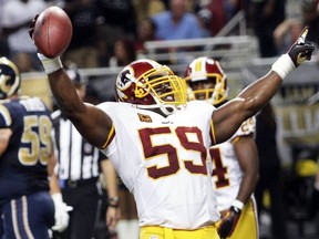 FILE - In this Sept. 16, 2012, file photo, Washington Redskins inside linebacker London Fletcher (59) celebrates an interception in the end zone during the third quarter of an NFL football game against the St. Louis Rams in St. Louis. Tony Gonzalez, Ed Reed, Champ Bailey and London Fletcher are first-year eligible players among the 102 modern-era nominees for the class of 2019 for the Pro Football Hall of Fame, announced Thursday, Sept. 13, 2018.