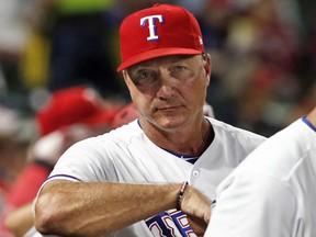 FILE - In this Tuesday, Sept. 18, 2018, file photo, Texas Rangers manager Jeff Banister watches from the dugout during the seventh inning of a baseball game against the Tampa Bay Rays in Arlington, Texas. The Rangers fired Banister on Friday, Sept. 21, 2018.