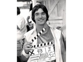 In this Aug. 19, 1985 image provided by Driven Pictures, professional stuntman Eddie Braun poses with a slate on set. The new documentary titled "Stuntman", backed by the production company of action star Dwayne Johnson, is a nearly 90-minute film about Braun's career as a stuntman and his successful jump over the Snake River Canyon in a steam-powered rocket cycle on Sept. 16, 2016. (Driven Pictures via AP)