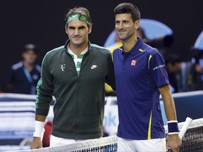 FILE - In this Jan. 28, 2016, file photo, Roger Federer, left, of Switzerland and Novak Djokovic, right, of Serbia, pose for a photo ahead of their semifinal match at the Australian Open tennis championships in Melbourne, Australia. The pair will team up for the first time when they take on Jack Sock and Kevin Anderson in doubles on the first day of the second edition of the Laver Cup on Friday in Chicago.