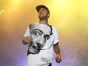 FILE - In this July 13, 2013, file photo, Rapper Mac Miller performs on his Space Migration Tour at Festival Pier in Philadelphia. Los Angeles County coroner's spokeswoman Sarah Ardalani said Monday, Sept. 10, 2018, that investigators have performed the autopsy and released the Miller's body to the family, but a cause will not be announced until the results of toxicology tests that can take weeks or months. Miller was found dead in his Los Angeles home last week.