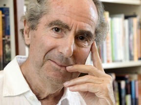 FILE - In this Sept. 8, 2008, file photo, author Philip Roth poses for a photo in the offices of his publisher, Houghton Mifflin, in New York.  Friends and admirers will gather Tuesday, Sept. 25, 2018, at the New York Public Library for a tribute to Philip Roth, who died in May.