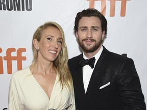 FILE - In this Sept. 6, 2018 file photo, director Sam Taylor-Johnson, left, and her actor husband Aaron Taylor-Johnson attend the gala for "Outlaw King" at the Toronto International Film Festival in Toronto. James Frey's "A Million Little Pieces," once one of the most toxic properties in Hollywood, has been reborn on the big screen thanks to director Sam Taylor-Johnson and her husband, whom she wrote it with.