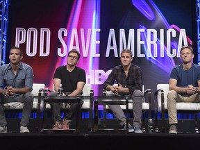 FILE - In this July 25, 2018 file photo, Jon Favreau, from left, Jon Lovett, Dan Pfeiffer and Tommy Vietor participate in the "Pod Save America" panel during the HBO Television Critics Association Summer Press Tour in Beverly Hills, Calif. The popular political podcast "Pod Save America" is coming to HBO for four specials, just in time for the midterm elections. It will debut Friday, Oct. 12 at 11 p.m. EST and air new episodes for the following three Fridays at the same time.