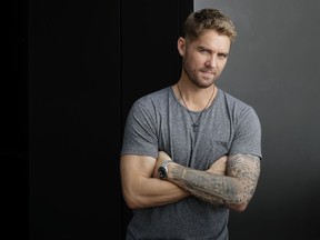 In this Aug. 8, 2018, photo, Brett Young poses in Nashville, Tenn. The Southern California-native has taken over as country music's new heartbreak kid, thanks to that triple-platinum song and a string of other emotional, heartfelt ballads from this debut self-titled album in 2017. But he promises more tempo on the new album, including the title track "Ticket to L.A.," which releases later this year.