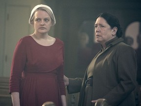 This image released by Hulu shows Elisabeth Moss, left, and Ann Dowd in a scene from "The Handmaid's Tale." The program was nominated for an Emmy on Thursday for outstanding drama series. The 70th Emmy Awards will be held on Monday, Sept. 17.