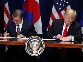 President Donald Trump and South Korean President Moon Jae-In participate in a signing ceremony for the United States-Korea Free Trade Agreement at the Lotte New York Palace hotel during the United Nations General Assembly, Monday, Sept. 24, 2018, in New York.