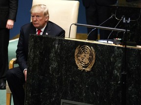 President Donald Trump sits down after delivering a speech to the United Nations General Assembly, Tuesday, Sept. 25, 2018, at U.N. Headquarters.