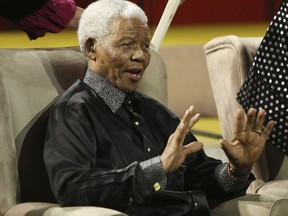 FILE - In this July 22, 2007, file photo, Nelson Mandela gestures during the 5th annual Nelson Mandela Lecture at the Linder Auditorium in Johannesburg, South Africa. The United Nations is seeking to harness the soaring symbolism of Mandela, whose South African journey from anti-apartheid leader to prisoner to president to global statesman is one of the 20th century's great stories of struggle, sacrifice and reconciliation. The unveiling of a statue of Mandela, born 100 years ago, with arms outstretched at the U.N. building in New York on Monday, Sept. 24, 2018, opens a peace summit at the General Assembly.