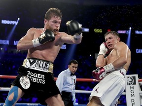 Canelo Alvarez, left, and Gennady Golovkin trade punches during a middleweight title boxing match, Saturday, Sept. 15, 2018, in Las Vegas. Alvarez won by majority decision.