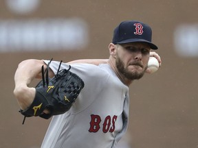 FILE - In this Sunday, July 22, 2018 file photo,Boston Red Sox starting pitcher Chris Sale throws during the third inning of a baseball game against the Detroit Tigers in Detroit. Cy Young Award contenders Chris Sale (12-4, 1.96) and Jacob deGrom (8-9, 1.71) face off for the first time since their college days as Boston hosts the Mets. DeGrom was a two-way player at Stetson in 2010 when he hit his only college homer off Sale, the ace at Florida Gulf Coast.