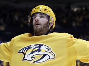 FILE - In this March 8, 2018 file photo Nashville Predators left wing Austin Watson celebrates after scoring a goal against the Anaheim Ducks in the second period of an NHL hockey game in Nashville, Tenn. Watson has been suspended without pay for the entire preseason and first 27 games of the regular season for domestic abuse. Commissioner Gary Bettman handed down the suspension Wednesday, Sept. 12, 2018 after an investigation and a hearing with Watson last week. Watson pleaded no contest in July to a charge of domestic assault stemming from an incident in June, and the league found Watson engaged in unacceptable off-ice conduct.