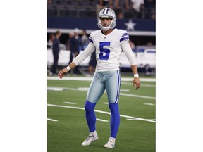 In this Aug. 26, 2018 photo Dallas Cowboys kicker Dan Bailey (5) looks on before an preseason NFL football game in Arlington, Texas. The Minnesota Vikings have waived rookie kicker Daniel Carlson, after the fifth-round draft pick pulled all three of his field-goal attempts wide right at Green Bay. The Vikings didn't immediately add a replacement for Carlson, but coach Mike Zimmer confirmed they've invited free agent Dan Bailey to Minnesota for a physical exam.