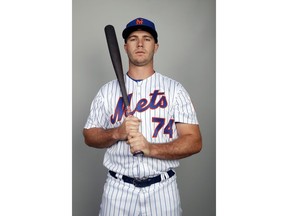 This is a 2018 photo of Peter Alonso of the New York Mets baseball team. This image reflects the Mets active roster as of Feb. 21, 2018 when this image was taken. Alonso finally put on a uniform at Citi Field on Wednesday, Sept. 12, 2018. Just not as part of New York's active roster. Alonso was honored on the field as the Mets' minor league player of the year about two weeks after New York frustrated its fans by declining to promote him to the major leagues. Alonso says he was "disappointed" to be kept off the major league roster, but he's using the decision as motivation for his offseason.