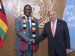 In this photo provided by the United Nations, U.N. Secretary General Antonio Guterres, right, meets with Emmerson Dambudzo Mnangagwa, President of the Republic of Zimbabwe, Tuesday, Sept. 25, 2018 at U.N. Headquarters.