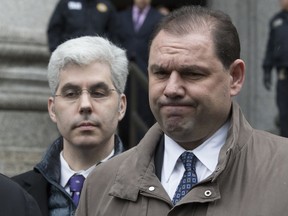 FILE- In this March 13, 2018, file photo, Joseph Percoco, right, former top aide to New York Gov. Andrew Cuomo, reacts while talking to reporters outside U.S. District court in New York. Percoco, whose bribery conviction was an election year embarrassment for the Cuomo administration, is scheduled to be sentenced in New York on Thursday, Sept. 20, 2018.