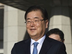 Chung Eui-yong, head of the presidential National Security Office, walks to board an aircraft as he and others in a delegation leave for Pyongyang, North Korea, at a military airport in Seongnam, south of Seoul, South Korea, Wednesday, Sept. 5, 2018. The high-level South Korean delegation left for North Korea to discuss arrangements for an inter-Korean summit there this month, as relations grow cooler between Washington and Pyongyang.
