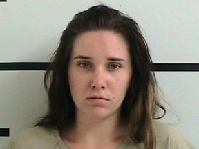 This undated photo provided by the Kerr County Jail shows Amanda Kristene Hawkins, who pleaded guilty Monday, Sept. 24, 2018, in Kerrville, Texas, to two counts each of child abandonment, child endangerment and injury to a child in the June 2017 deaths of her two daughters. (Kerr County Jail via AP)