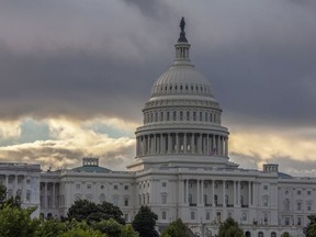 FILE - This Wednesday, Aug. 1, 2018, file photo shows the Capitol in Washington. As a potentially catastrophic hurricane heads for the Carolinas, Congress is moving to avert a legislative disaster that could lead to a partial government shutdown just weeks before the November midterm elections.