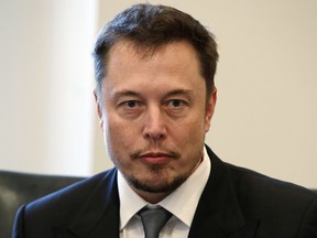 FILE - In this Dec. 14, 2016, file photo, Tesla CEO Elon Musk listens as President-elect Donald Trump speaks during a meeting with technology industry leaders at Trump Tower in New York. Electric carmaker Tesla must find a new chair for its board of directors under a settlement announced Saturday, Sept. 29, 2018, with the Securities and Exchange Commission. Whoever takes on the job will face the formidable task of overseeing Musk, a charismatic, visionary executive with an impulsive streak.