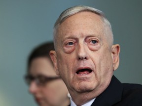 FILE - In this Tuesday, May 1, 2018, file photo, Secretary of Defense Jim Mattis answers a reporter's question during a meeting with Macedonian Defense Minister Radmila Sekerinska at the Pentagon. Mattis arrived in Macedonia on Monday, Sept. 17, condemning Russian efforts to use its money and influence to build opposition to an upcoming vote that could pave the way for the country to join NATO, a move Moscow opposes.