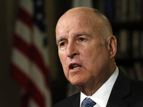 FILE - In this Sept. 10, 2018 file photo, Gov. Jerry Brown speaks during an interview with The Associated Press, in Sacramento, Calif.  California has become the first state to require publicly traded companies to include women on their boards of directors by 2020, according to a law signed Sunday, Sept. 30, 2018, by Gov. Jerry Brown.