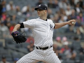 New York Yankees starting pitcher J.A. Happ throws during the first inning of a baseball game against the Baltimore Orioles at Yankee Stadium Sunday, Sept. 23, 2018, in New York.