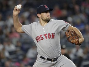 Boston Red Sox's Nathan Eovaldi delivers a pitch during the first inning of the team's baseball game against the New York Yankees on Tuesday, Sept. 18, 2018, in New York.