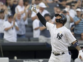 New York Yankees' Gleyber Torres reacts as he comes home after hitting a two-run home run during the fifth inning of a baseball game against the Detroit Tigers, Saturday, Sept. 1, 2018, at Yankee Stadium in New York.